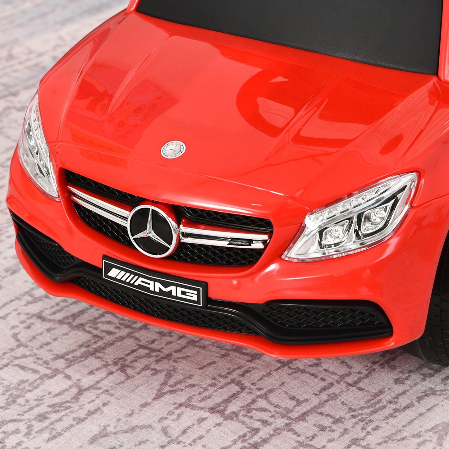 Ride-on children's car with push handle and backrest