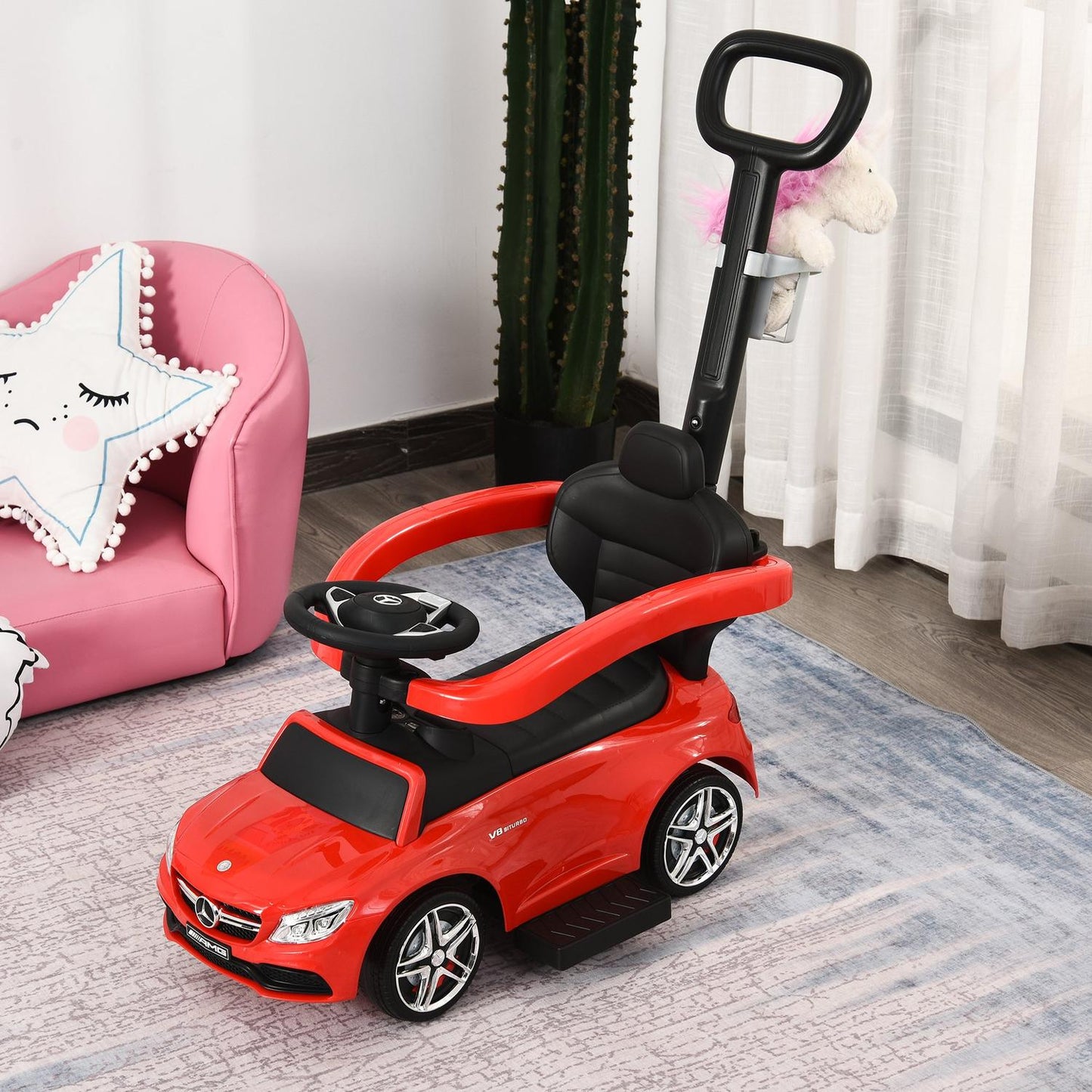 Ride-on children's car with push handle and backrest