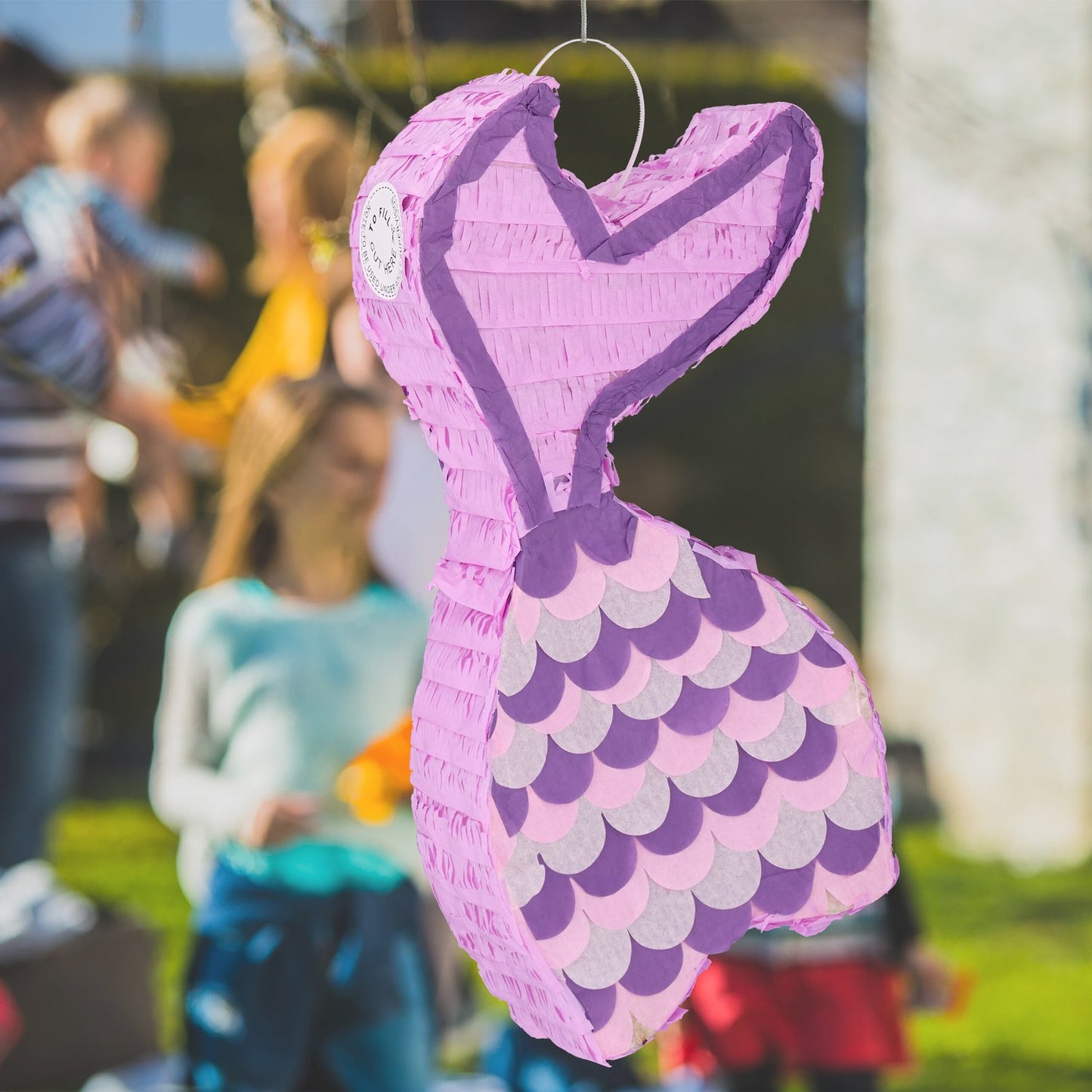 Mermaid pinata with lollipop and mask