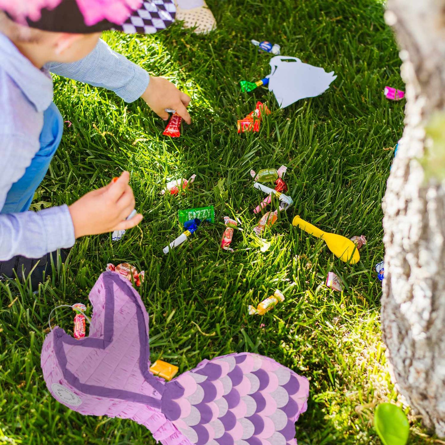 Mermaid pinata with lollipop and mask