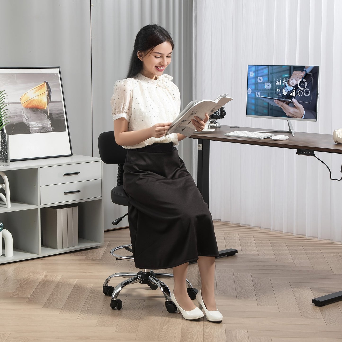 Ergonomic black office chair with foot ring, adjustable swivel