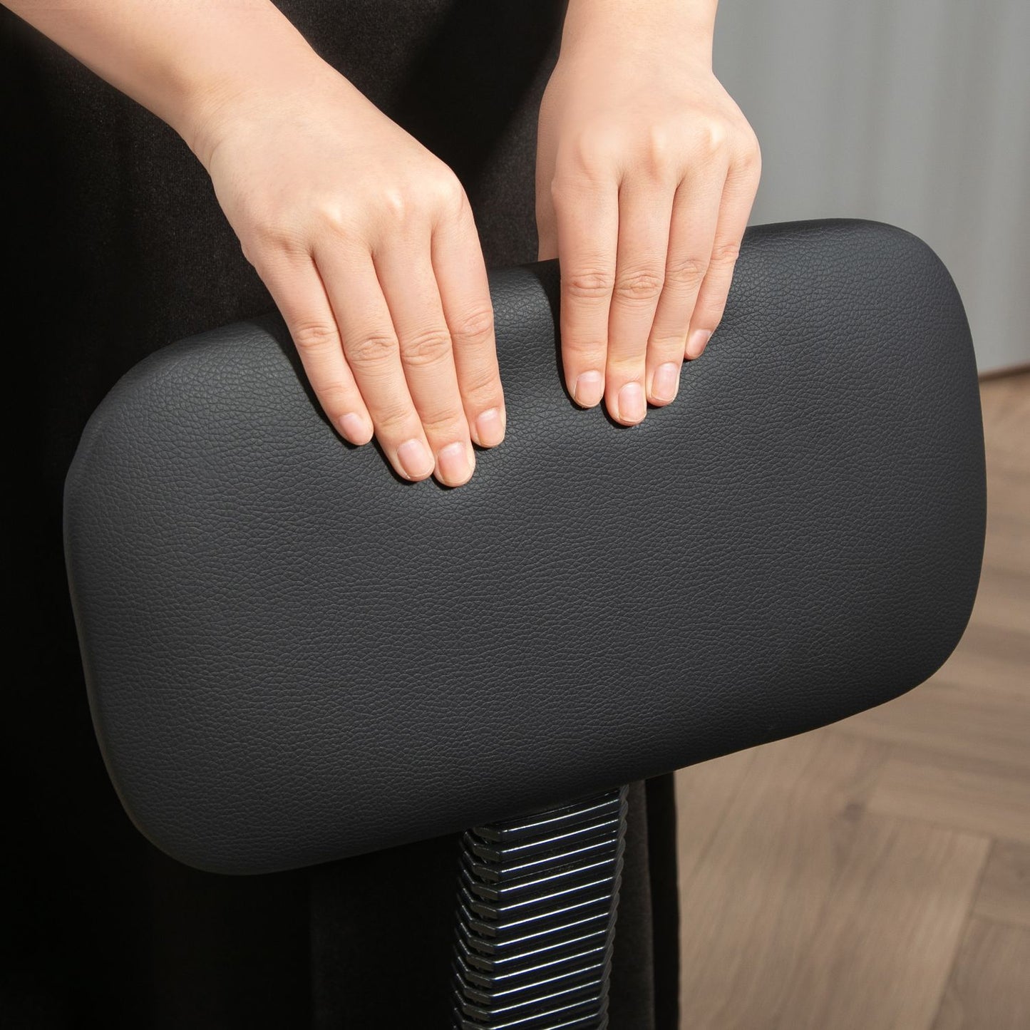 Ergonomic black office chair with foot ring, adjustable swivel