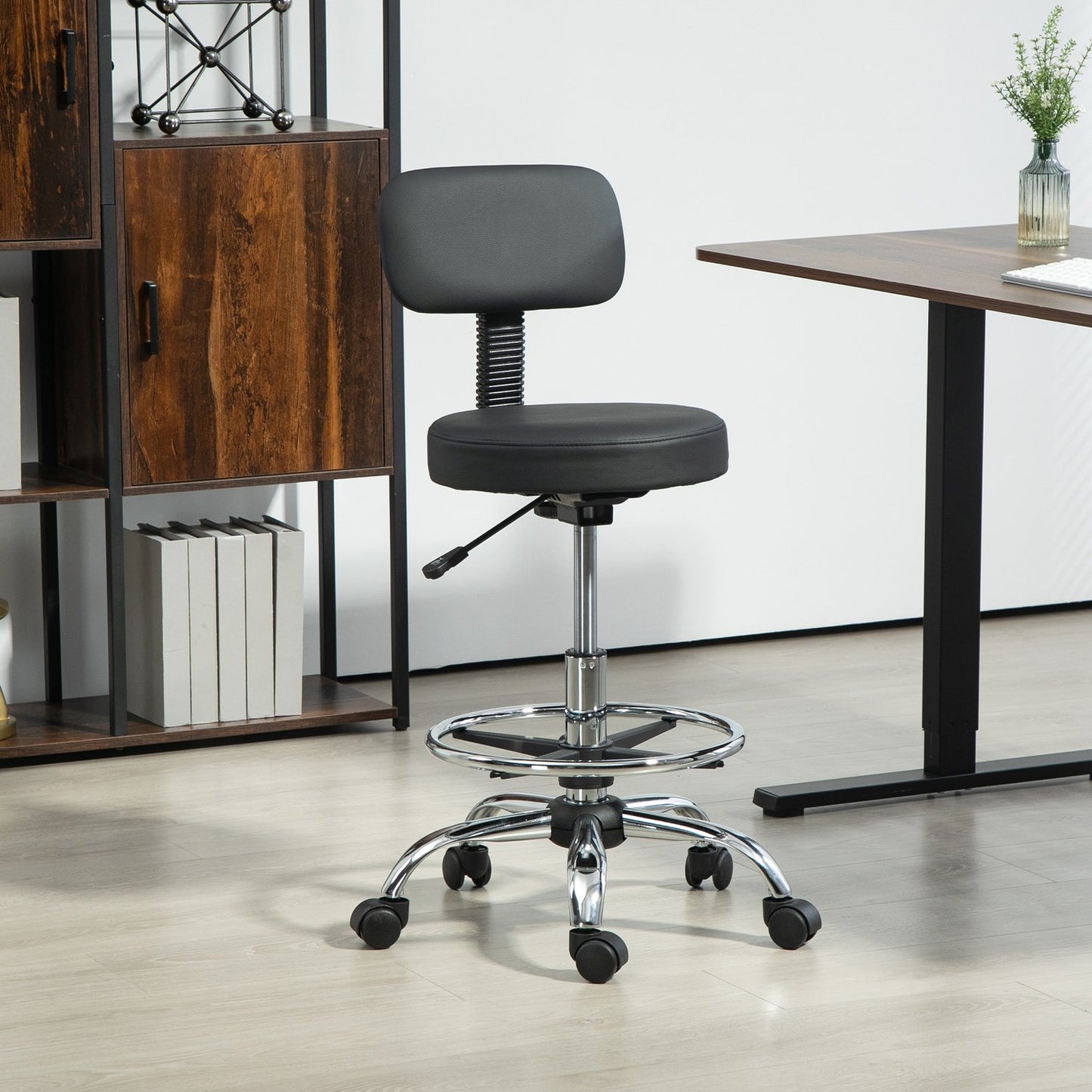 Ergonomic black office chair with foot ring, adjustable swivel