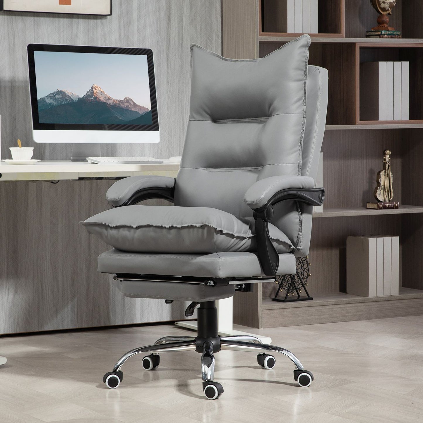 Ergonomic office chair with footrest, reclining and padded