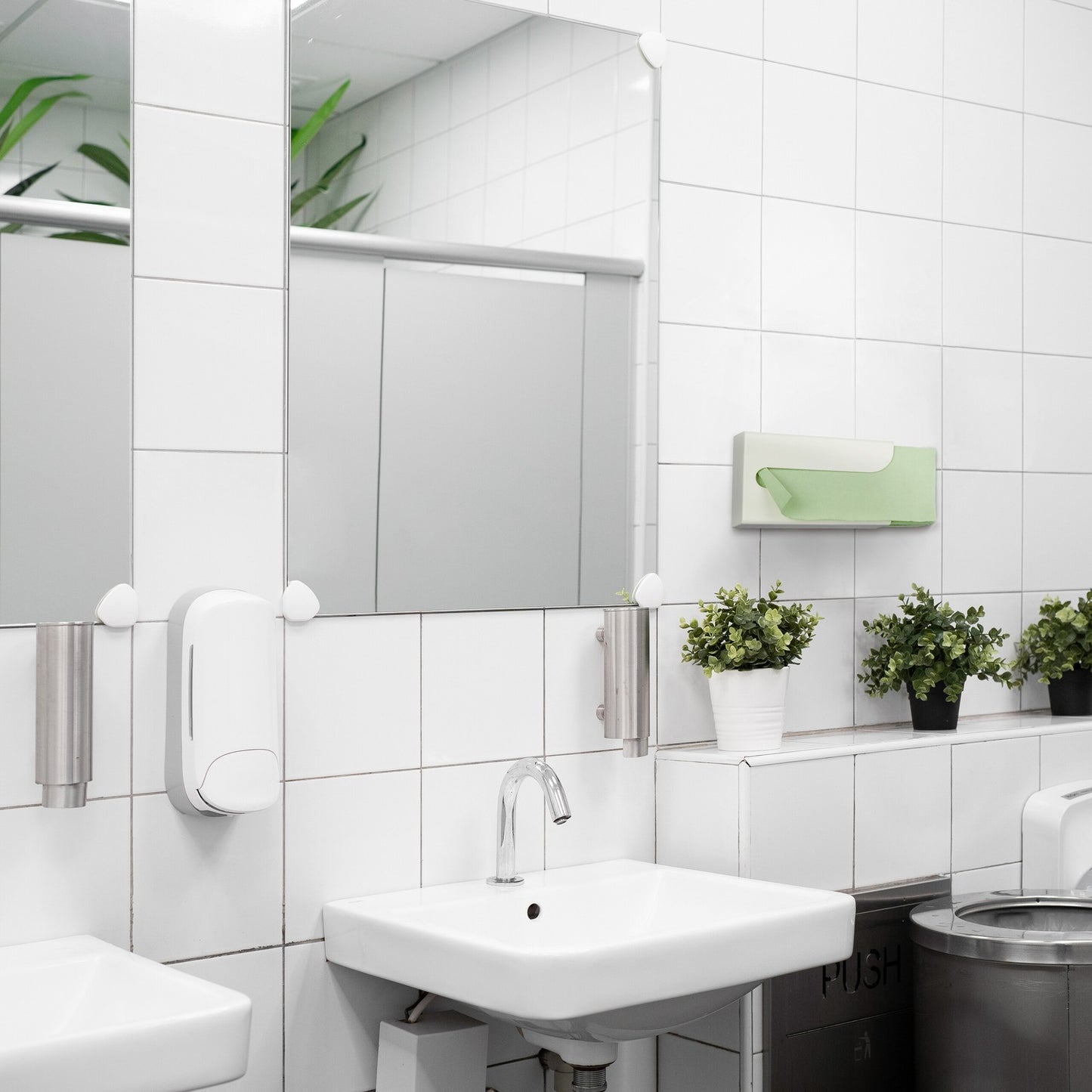 Paper dispenser for the wall in a set of 2