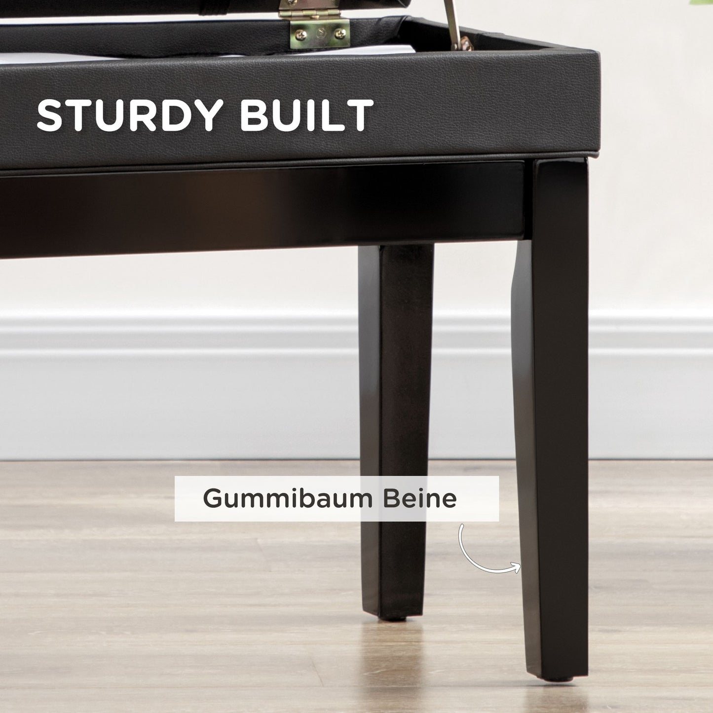 Height-adjustable piano bench in black leather with storage