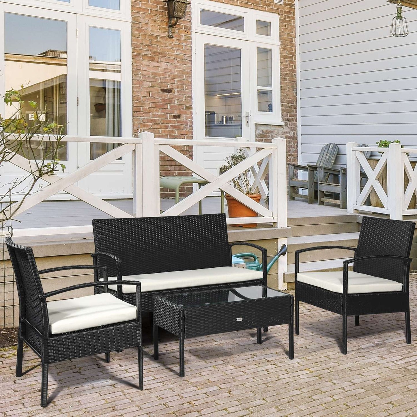Garden lounge set in poly rattan with cushions, black, seats 4