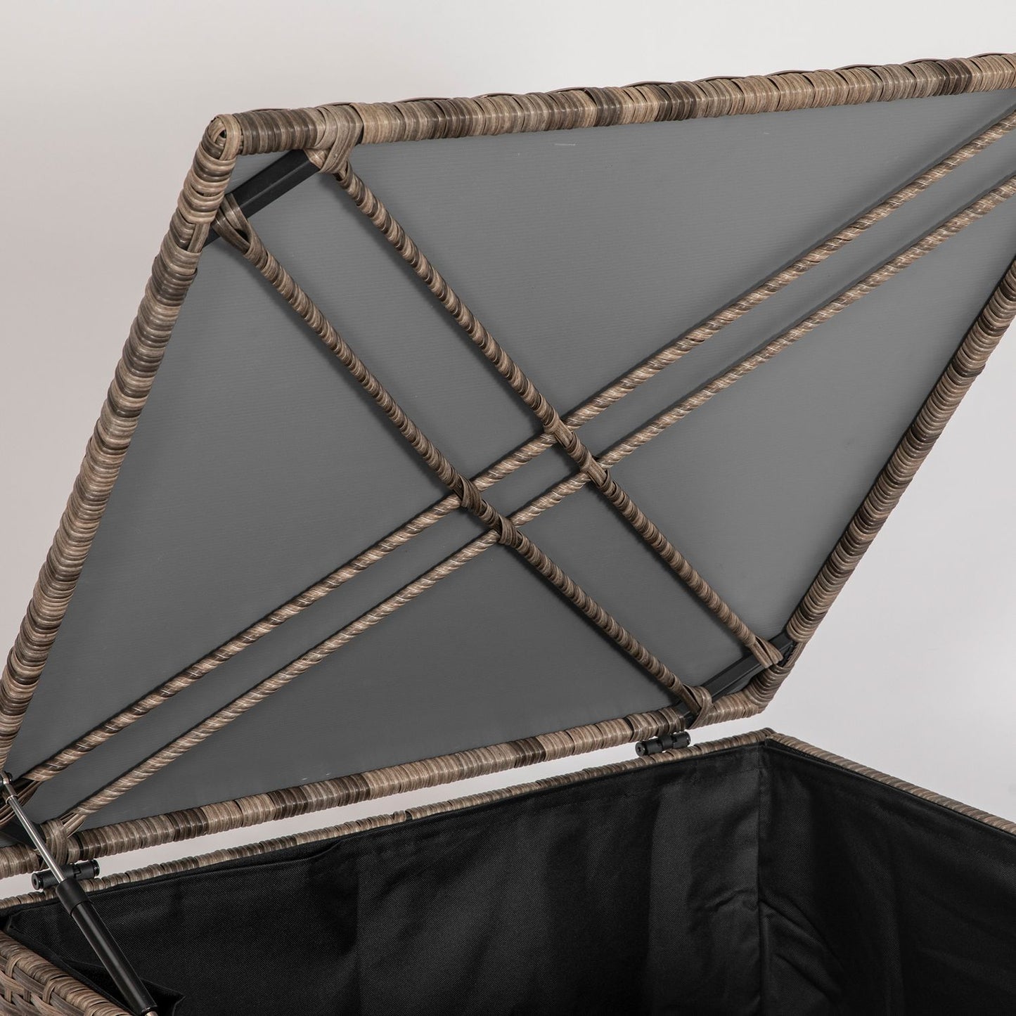 Weather-resistant storage box in poly rattan with auto-lift lid