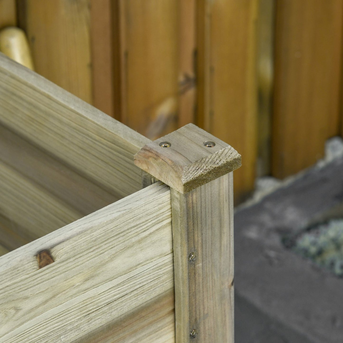 Raised wooden garden bed with shelf and drainage hole