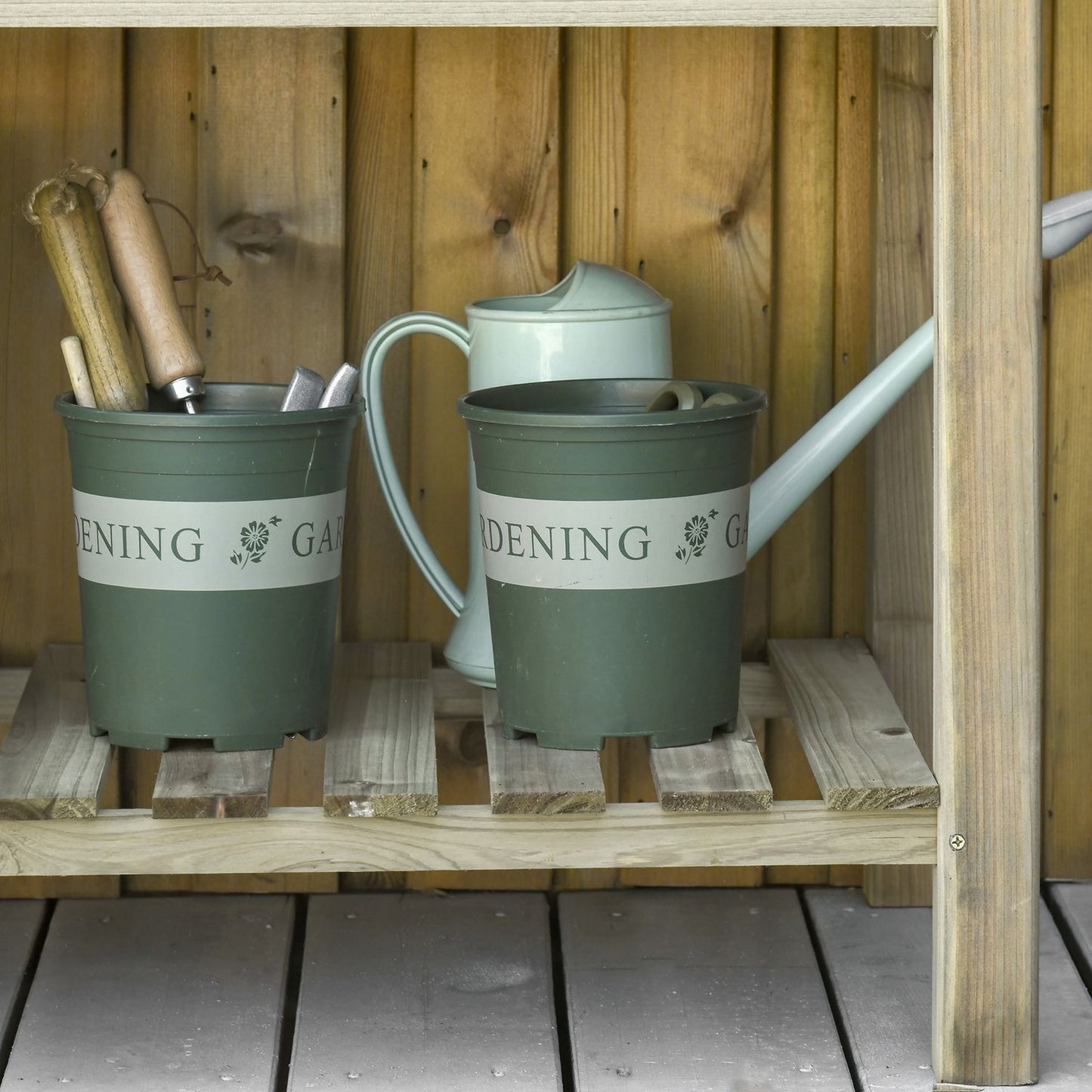 Raised wooden garden bed with shelf and drainage hole