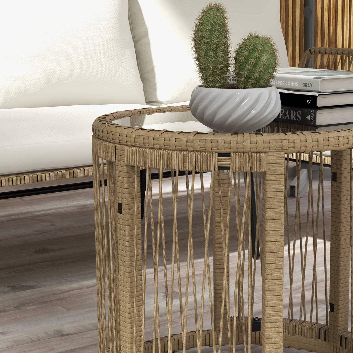 Rattan garden furniture with chair, table and cushions