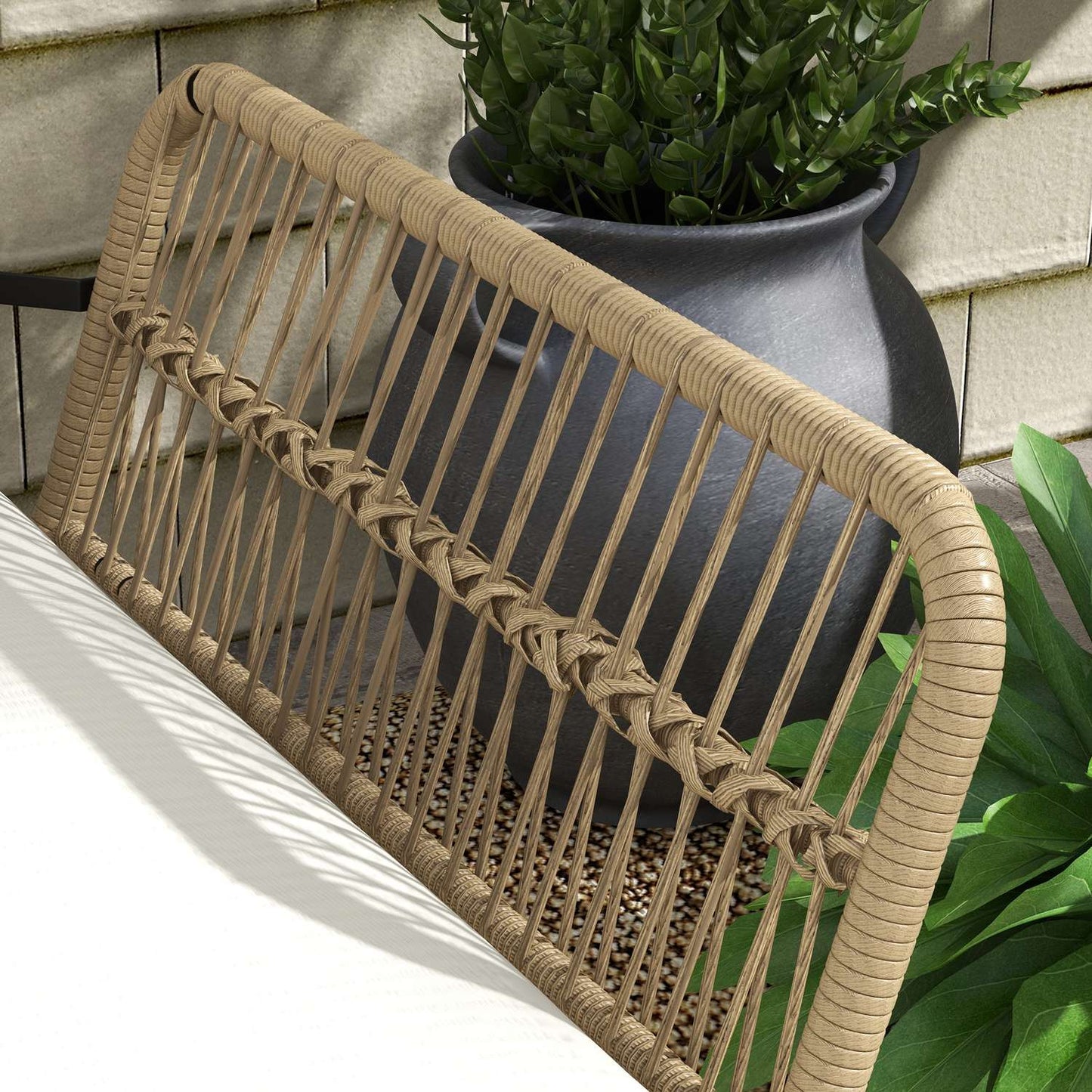 Rattan garden furniture with chair, table and cushions