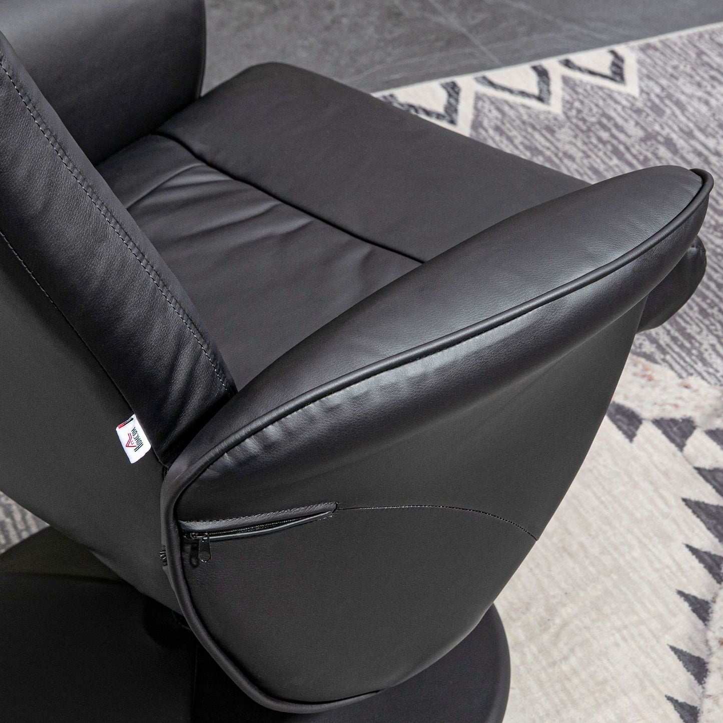 Black reclining swivel chair in artificial leather with stool