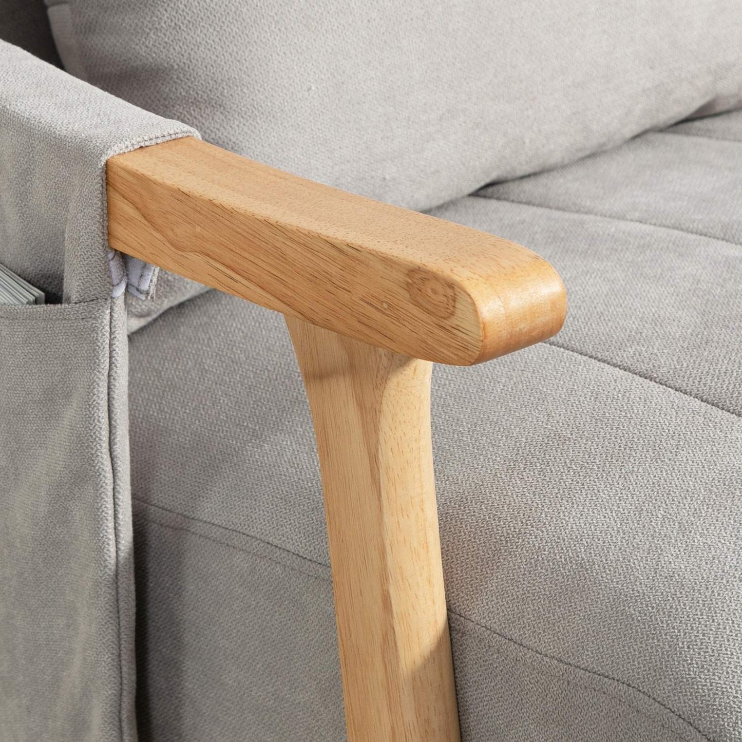 Gray padded rocking chair with lumbar support and side pocket