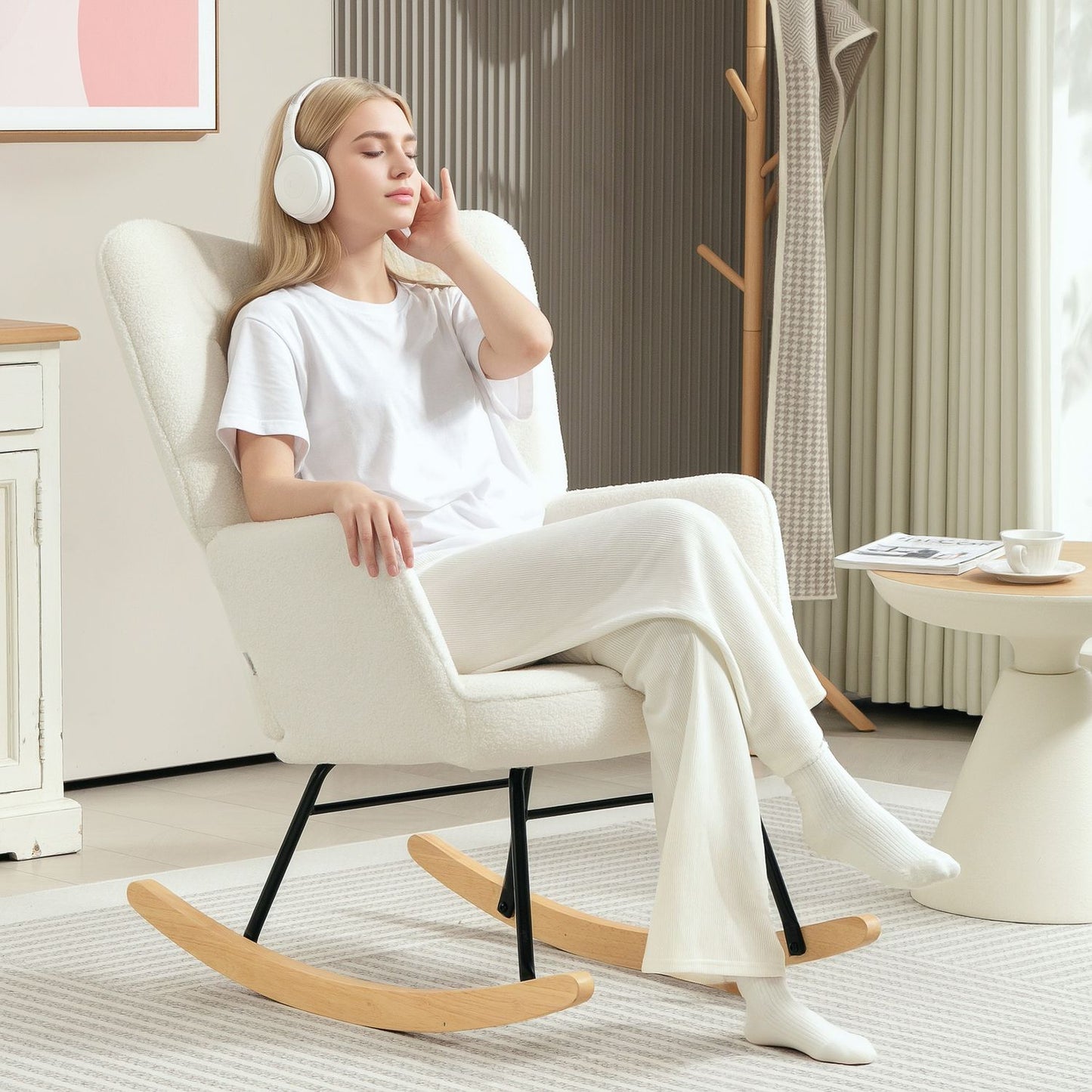 White padded rocking chair with armrests, wooden base