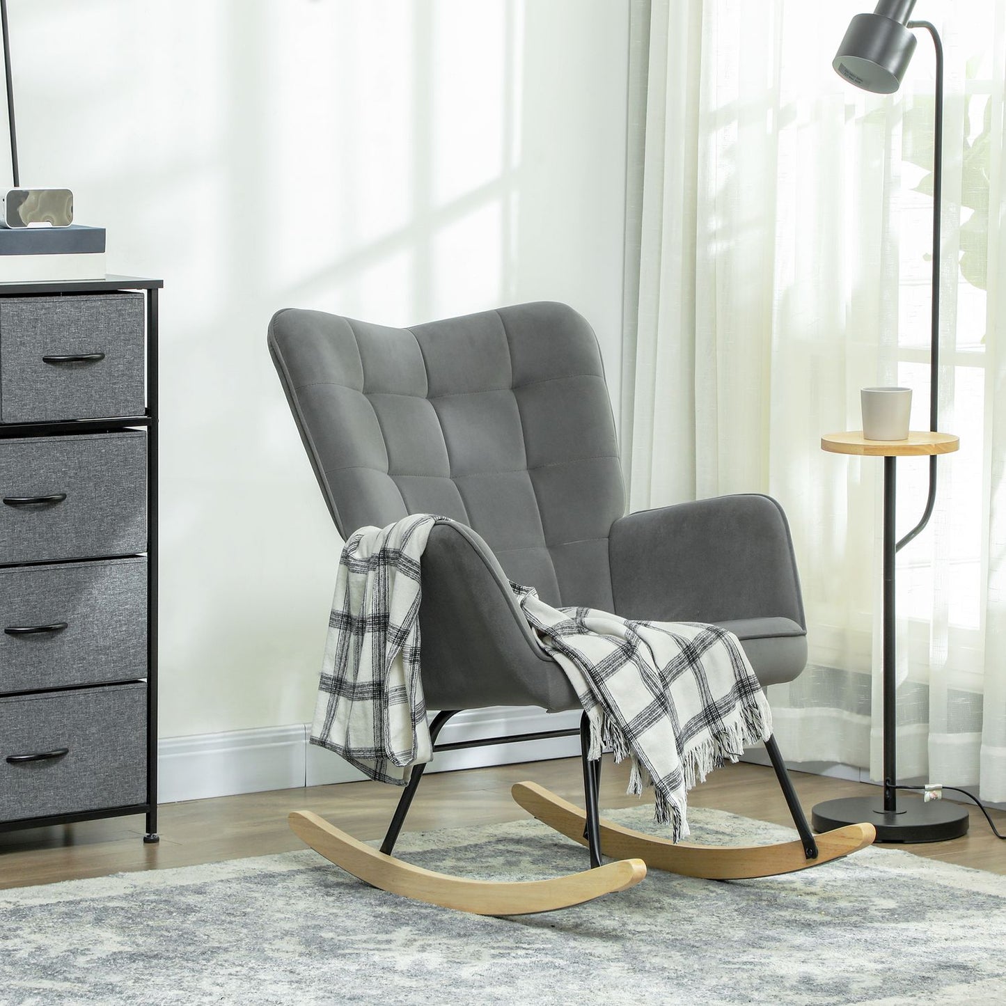 Dark gray rocking chair in velvet look with armrests