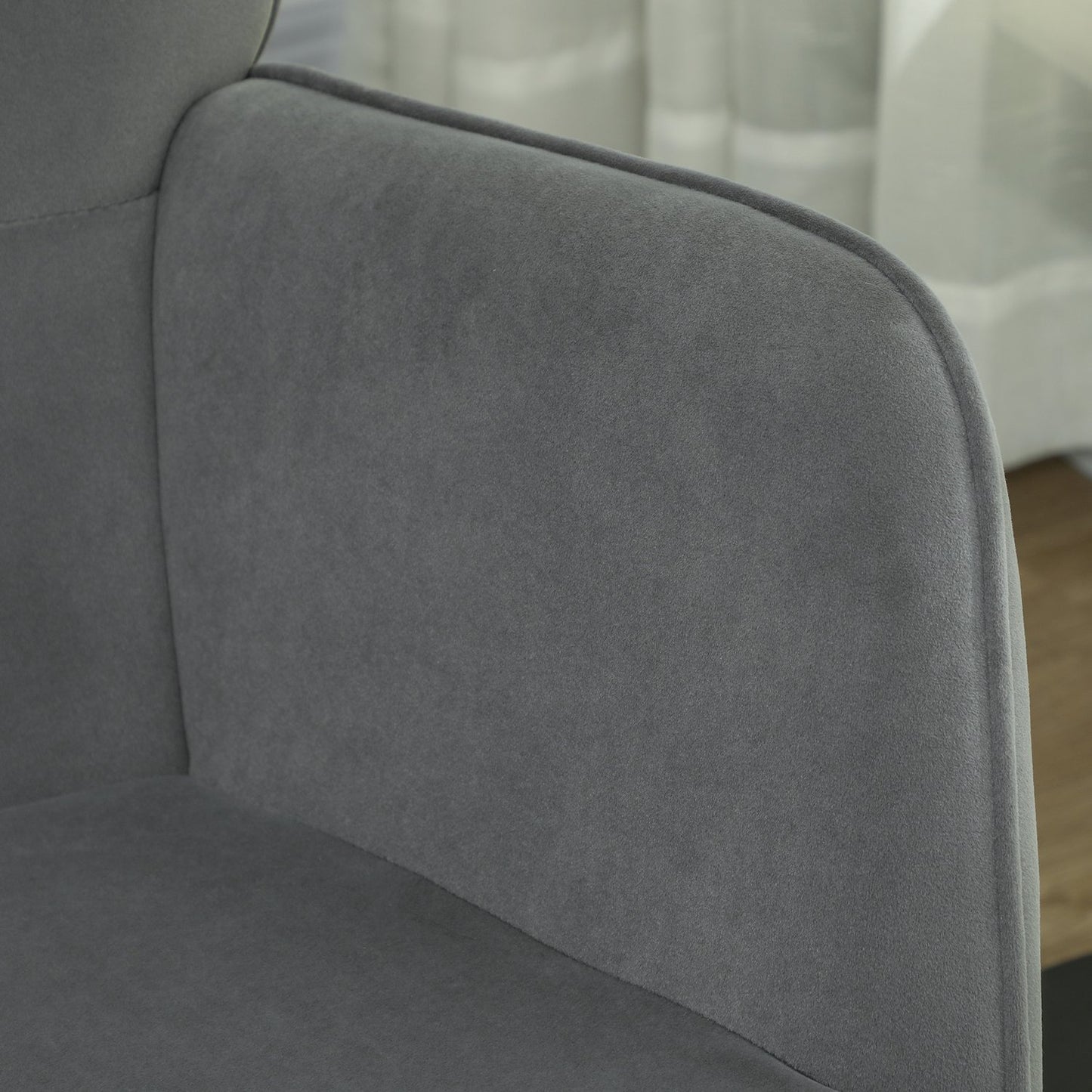 Dark gray rocking chair in velvet look with armrests