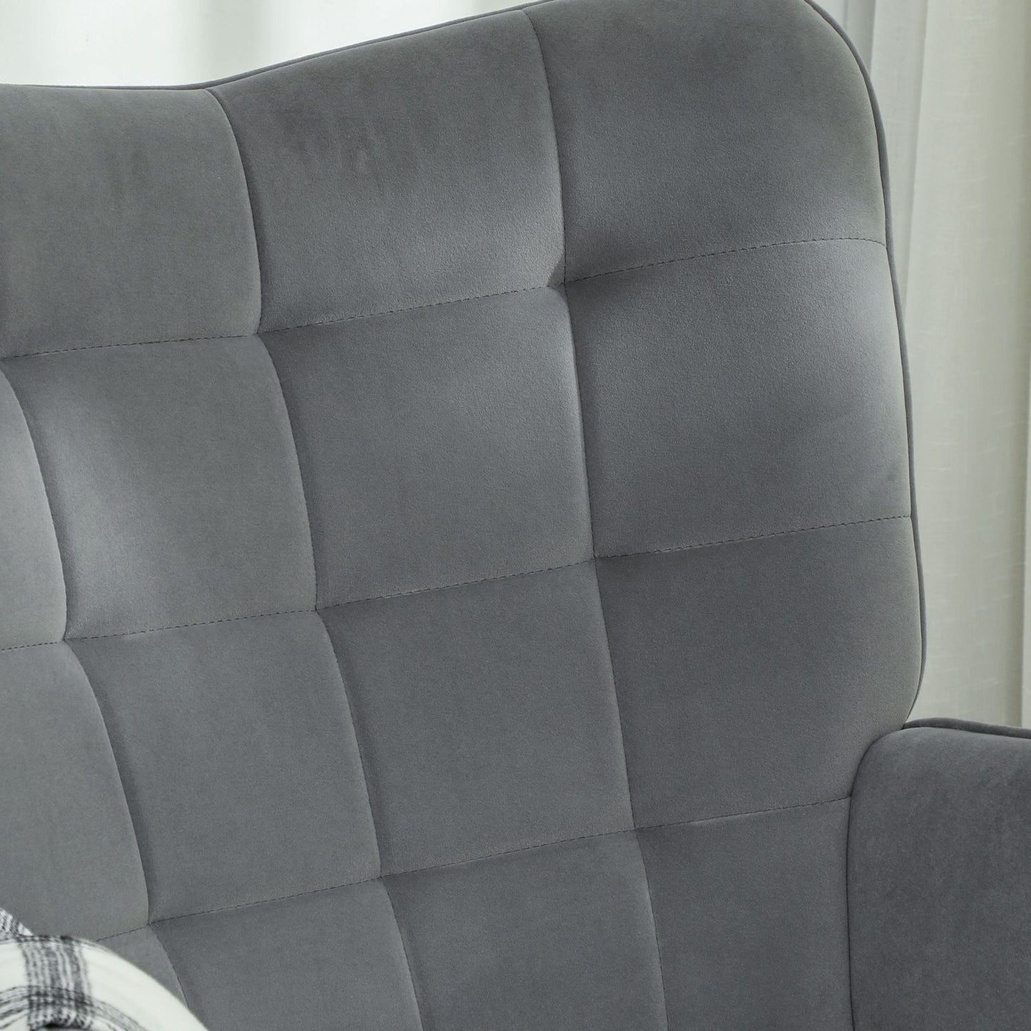 Dark gray rocking chair in velvet look with armrests