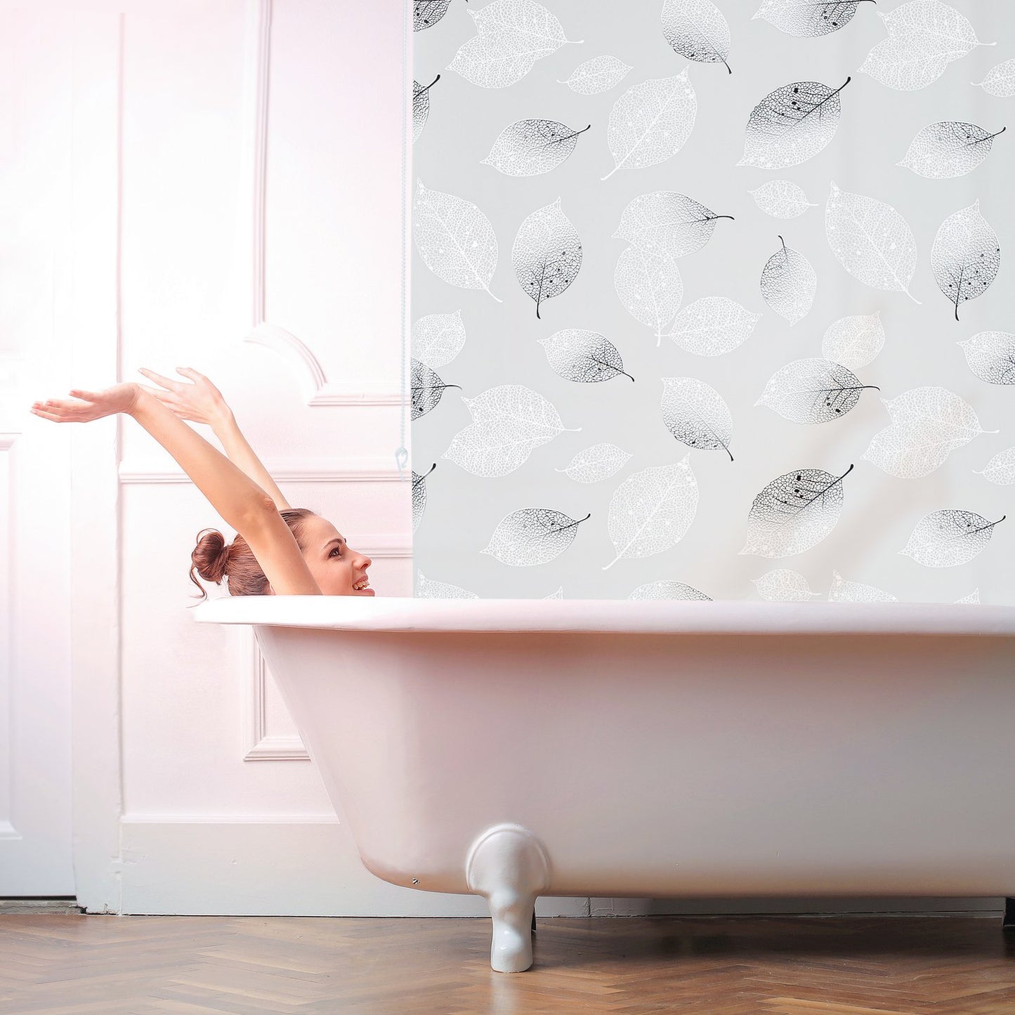 Roller blind for shower with leaf design