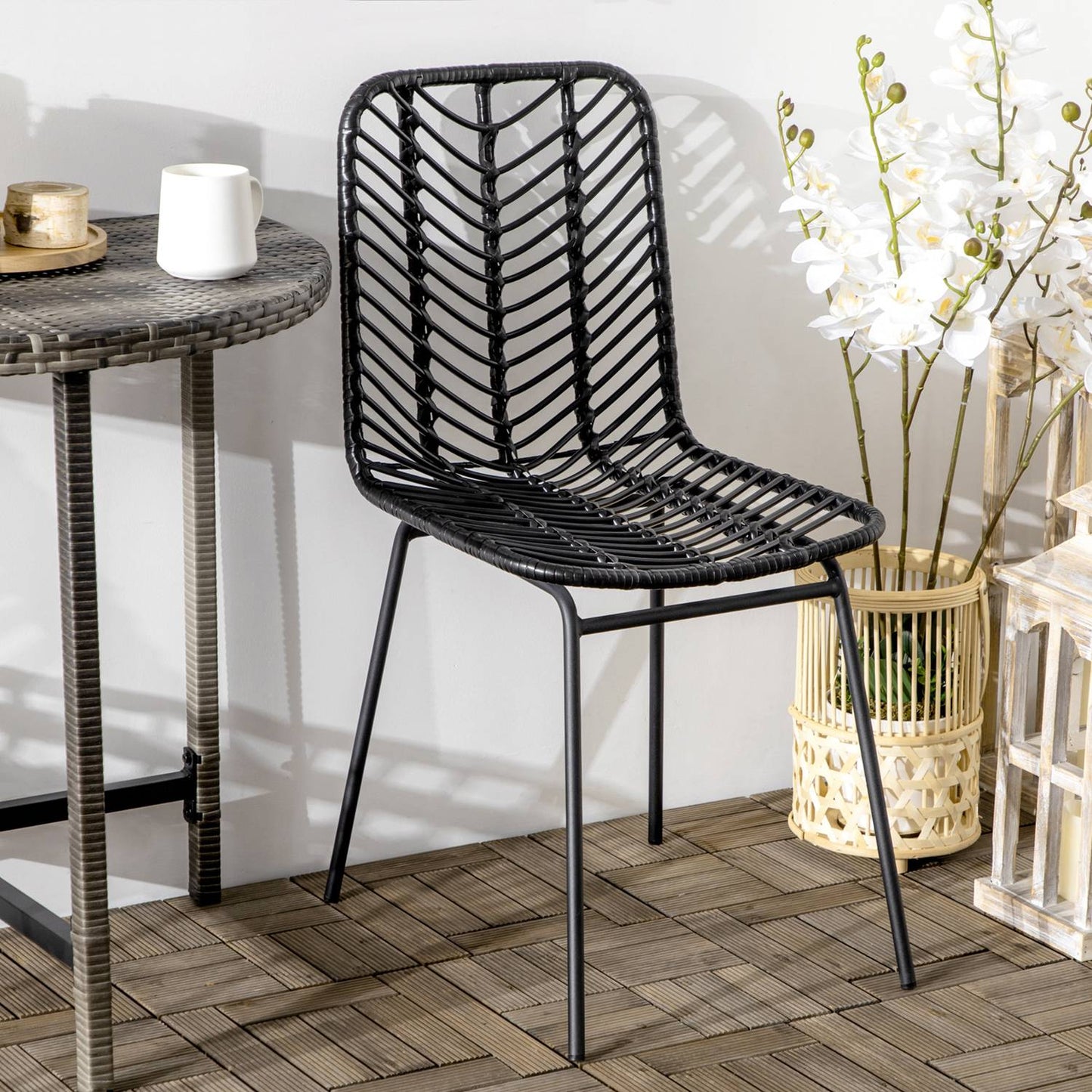 Set of 2 dining chairs in black rattan with backrest