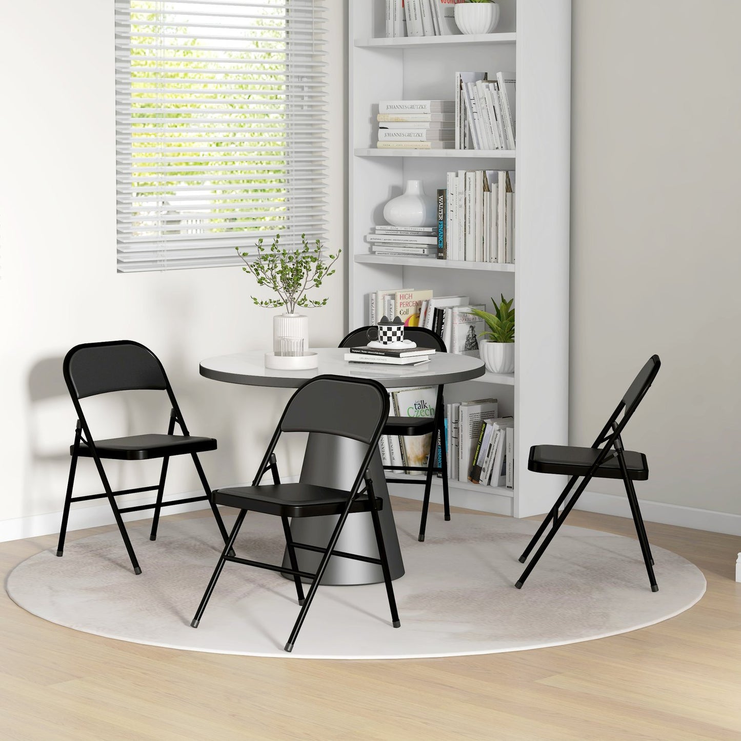 Folding chairs in artificial leather, padded, steel legs, black
