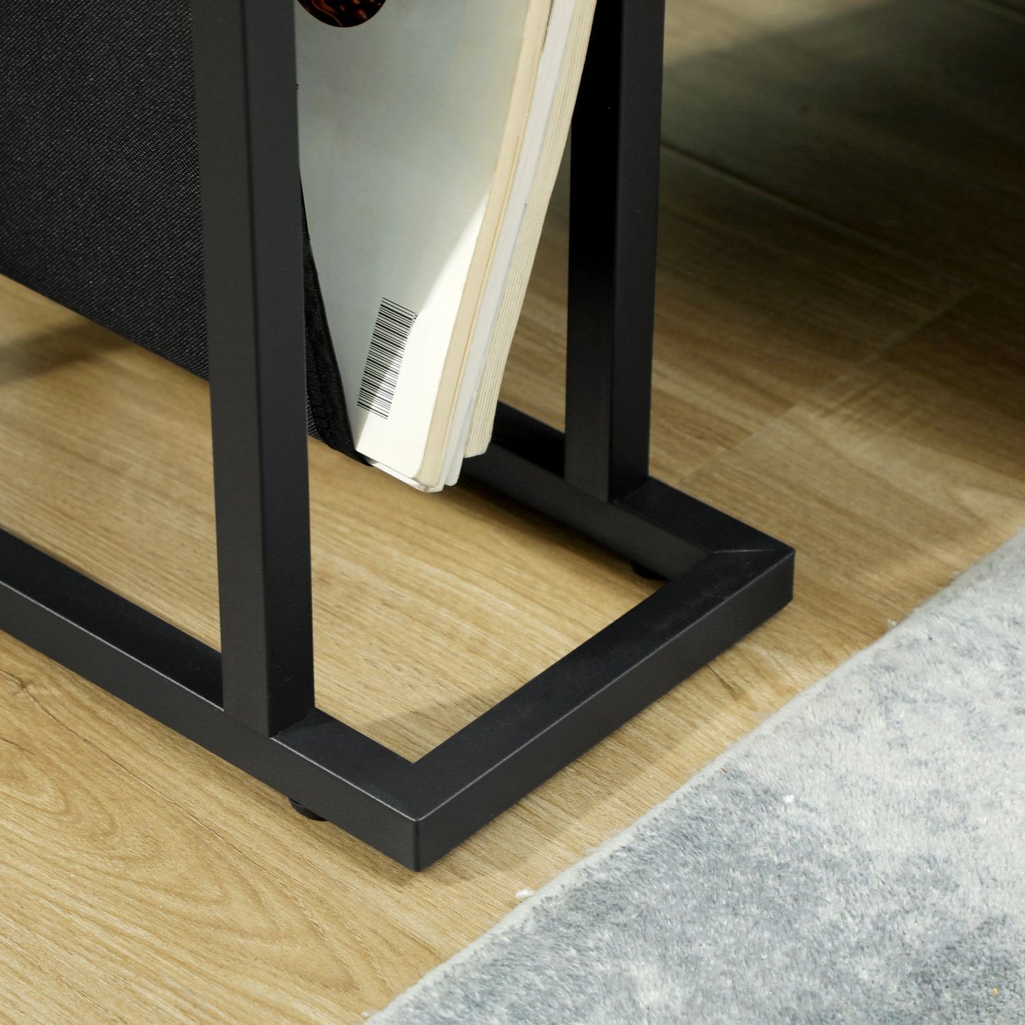 Black metal and glass side table with fabric storage bag