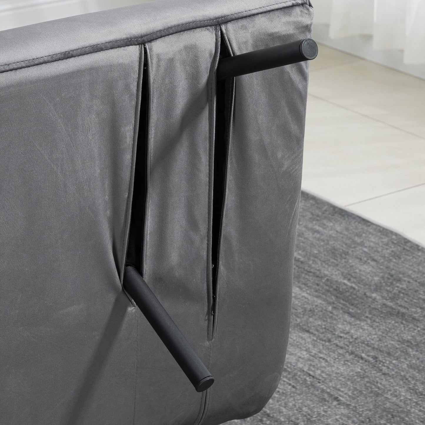 Dark gray velvet sofa bed with storage and cushion