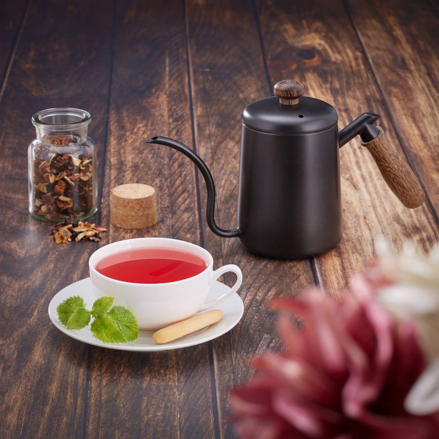 Stainless steel teapot with wooden handle