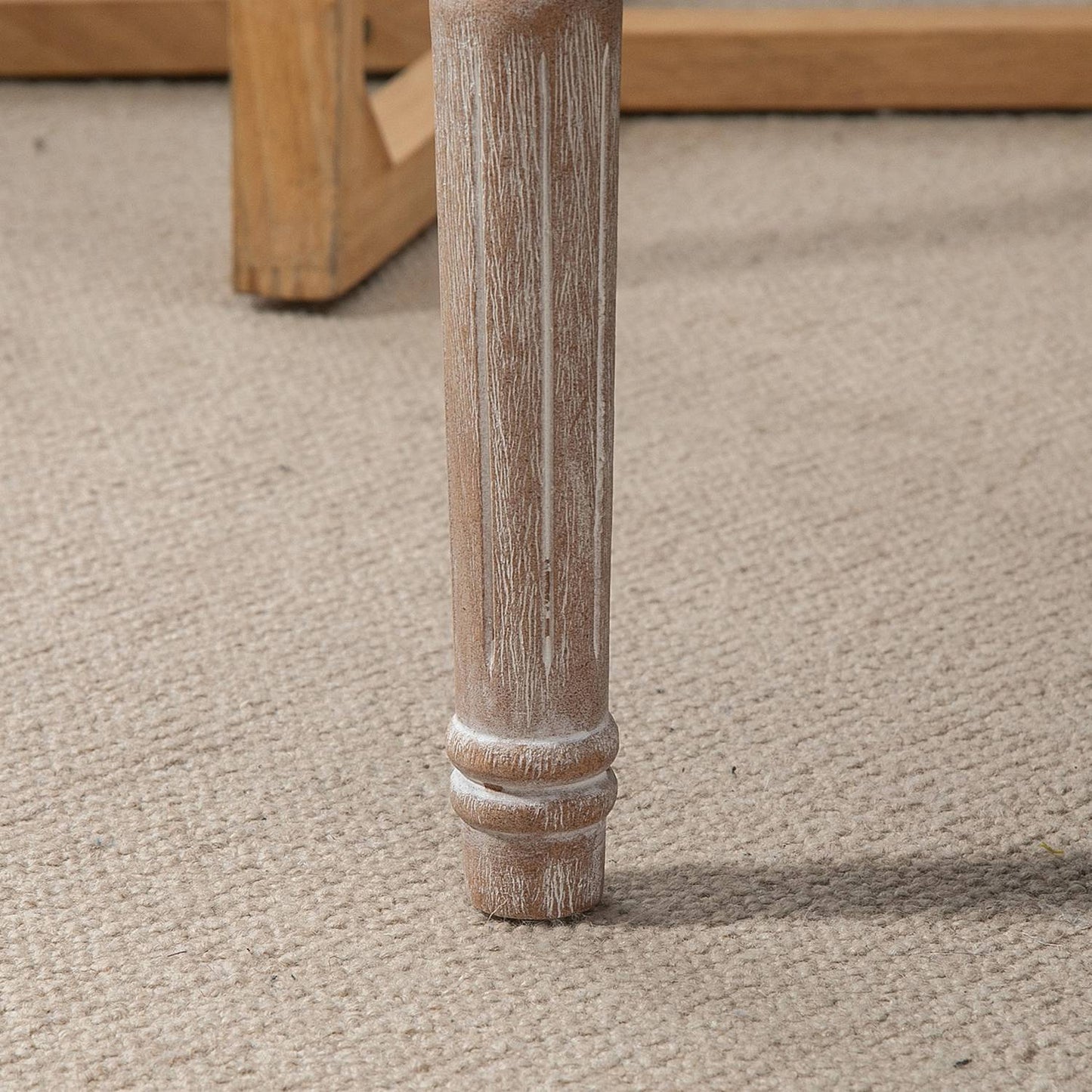 Footstool in linen look with padded seat and wooden legs
