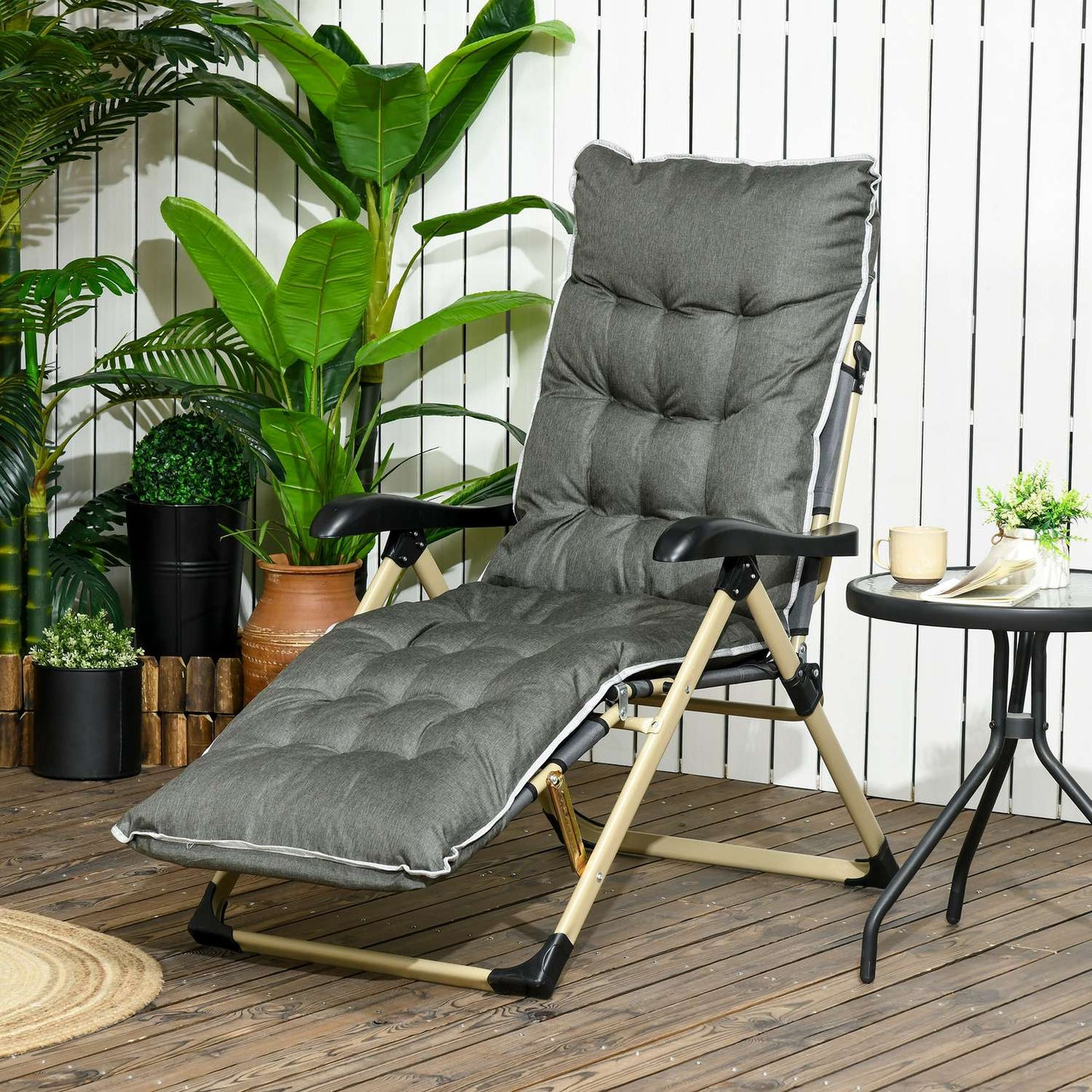 Folding sun lounger with adjustable backrest and cushion