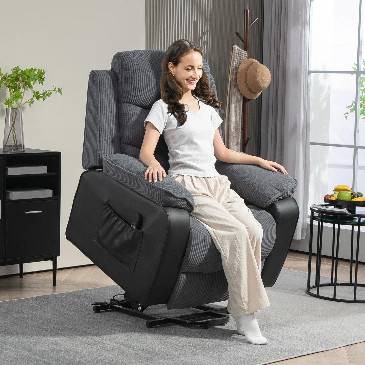 Electric reclining TV armchair with standing aid, dark grey