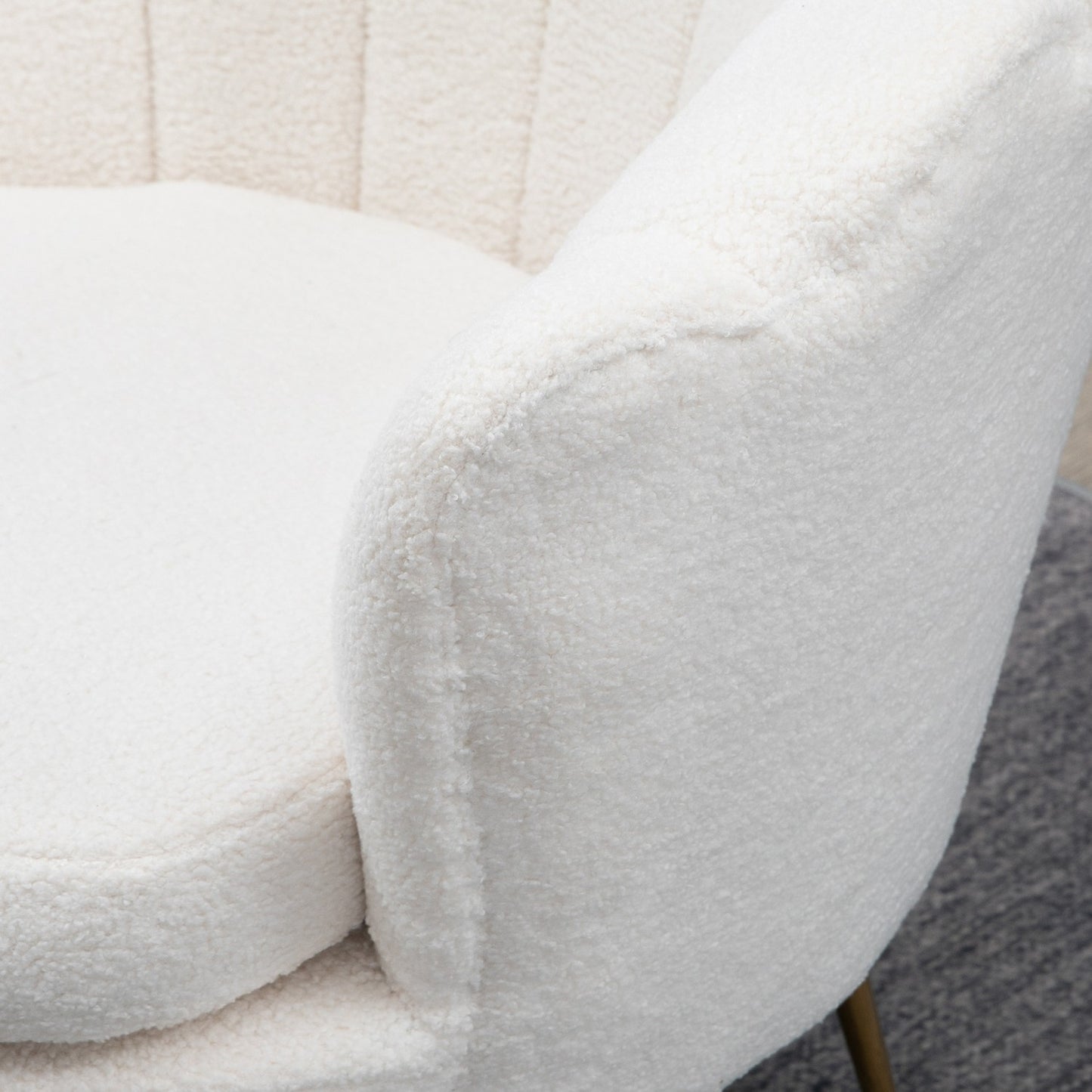 White shell upholstered armchair with metal legs