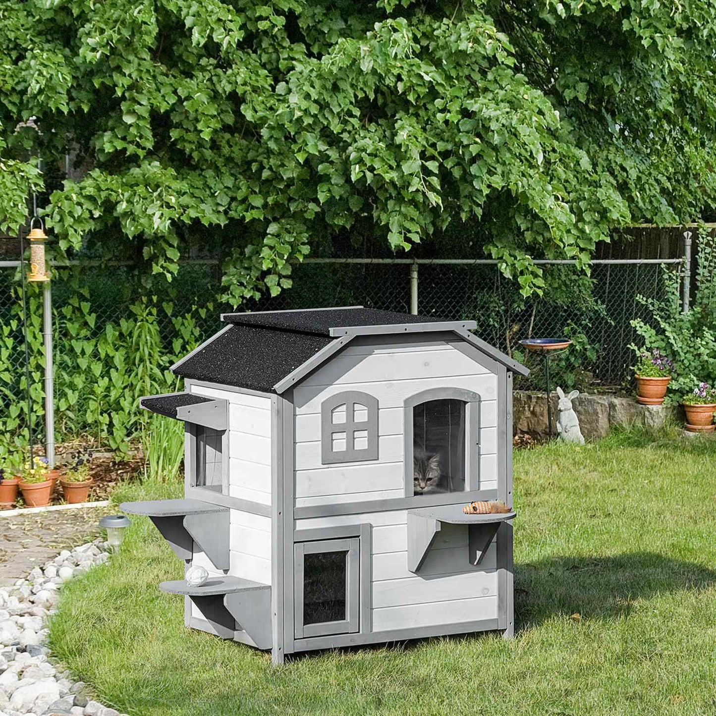 Outdoor wooden cat house with stairs for small cats