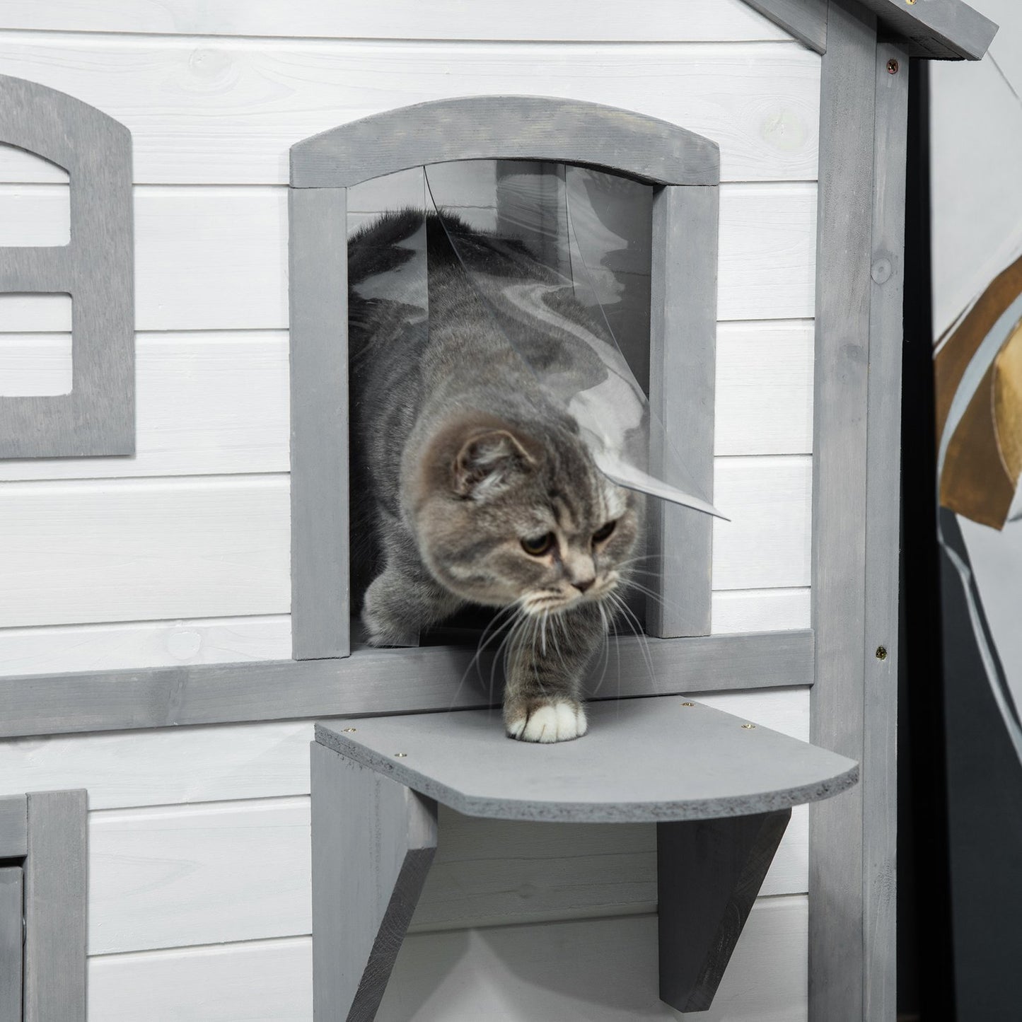 Outdoor wooden cat house with stairs for small cats