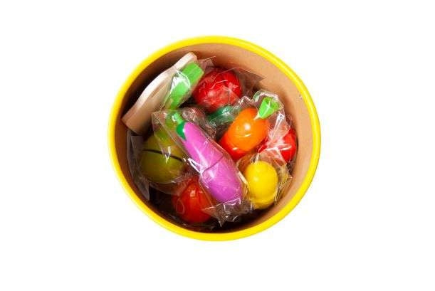 Wooden chopping vegetables in a bucket
