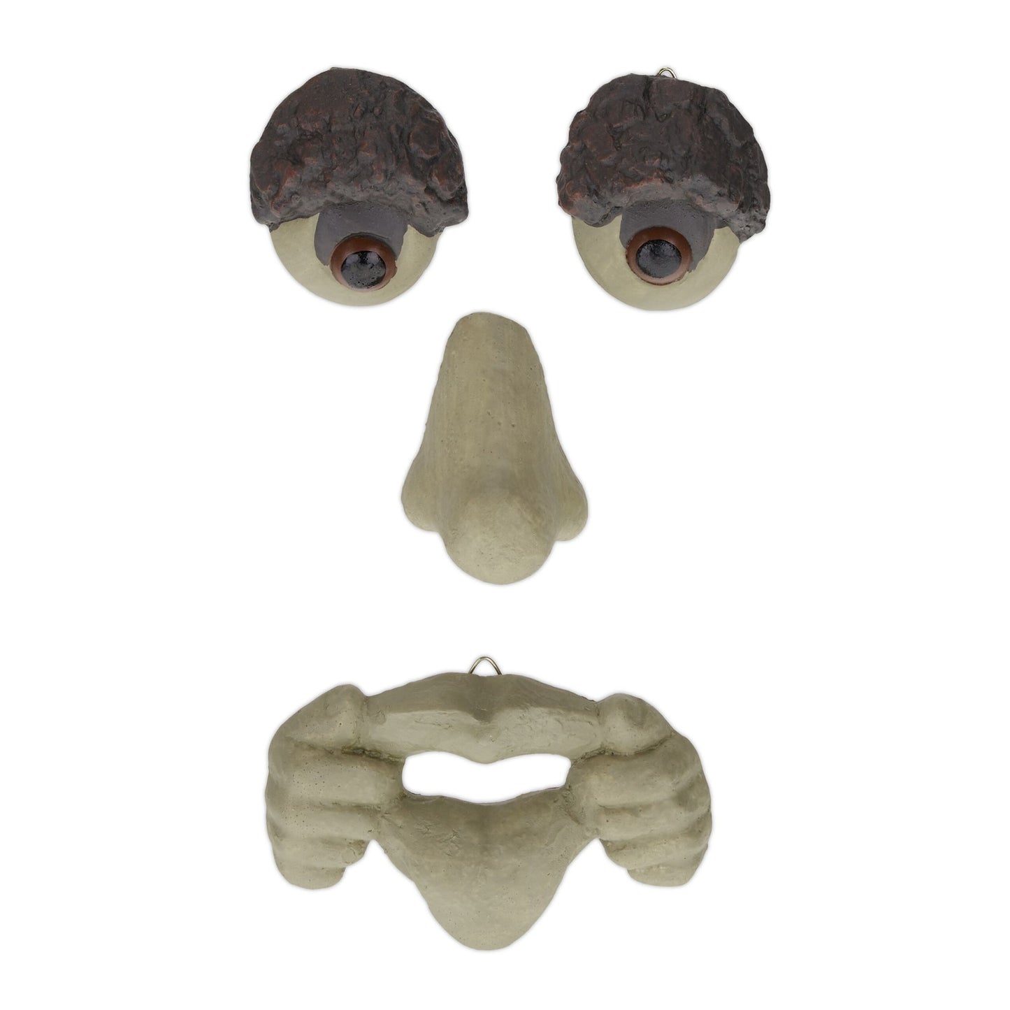 Wooden face with protruding tongue