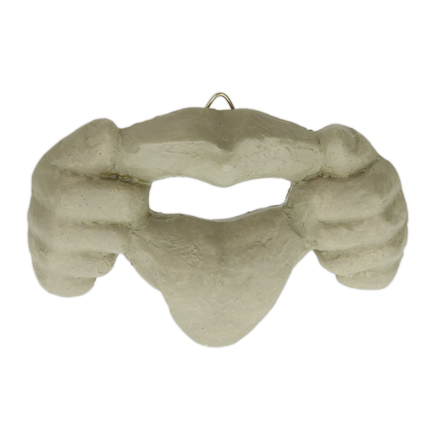 Wooden face with protruding tongue