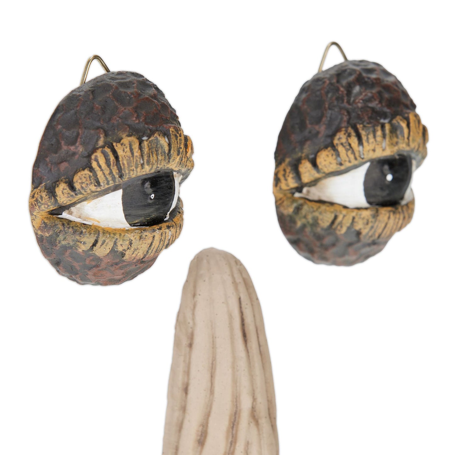 Wooden face with resting gesture